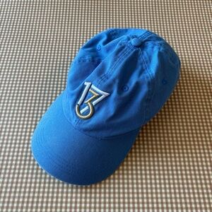 The players Golf blue performance hat. Adjustable
